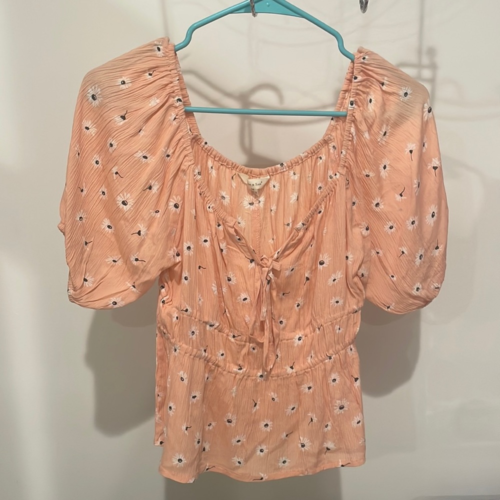 Boutique blouse. Light orange with flowers pattern.